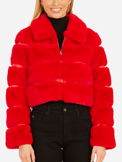 Red fur jacket worn by a person on a plain background