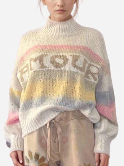 Person wearing a colorful sweater with 'AMOUR' text on a white background