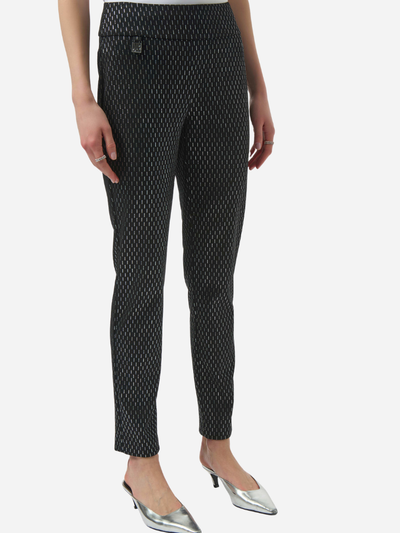 Black patterned pants worn by a person on a white background