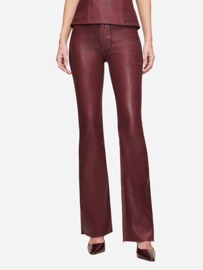 woman in burgundy coated bootcut denim