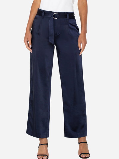 woman in blue paperbag leg silky pants