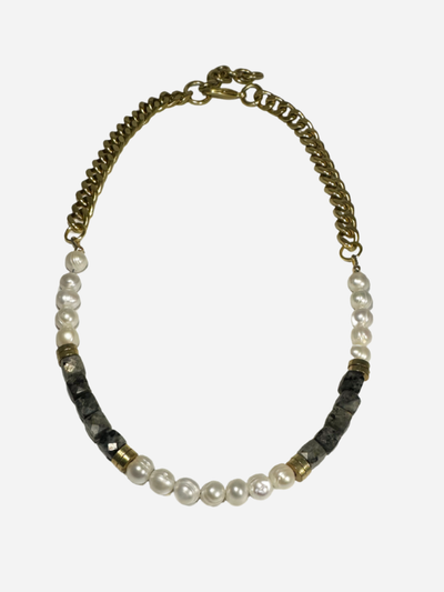 Necklace with pearls and black beads on a white background