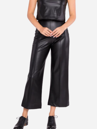 woman in vegan leather black cropped pants.