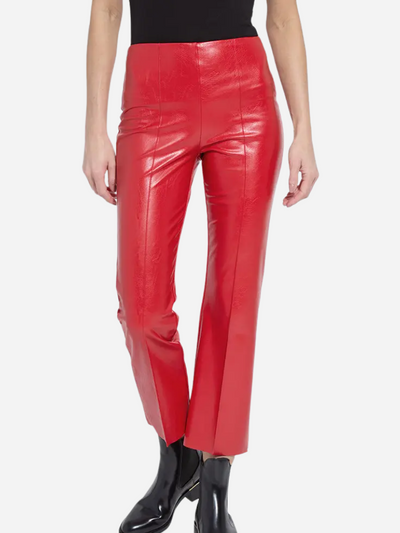 Red leather pants worn by a person on a white background