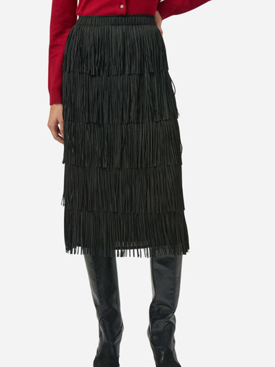 Black fringed pencil skirt worn by a woman on a white background