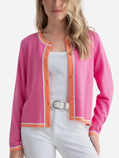 woman in pink cardigan with orange trim