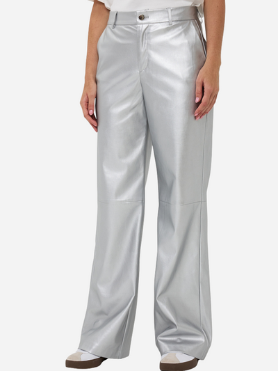 Silver metallic wide leg pants worn by a woman on a white background