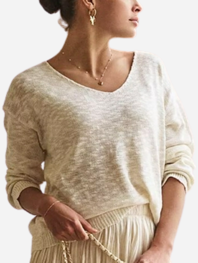 woman in cream v-neck sweater