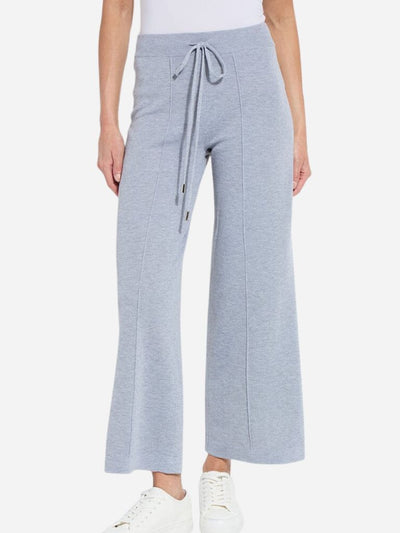 Light blue wide-leg pants with a drawstring waist on a white background
