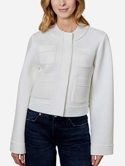 White cardigan worn by a person on a white background