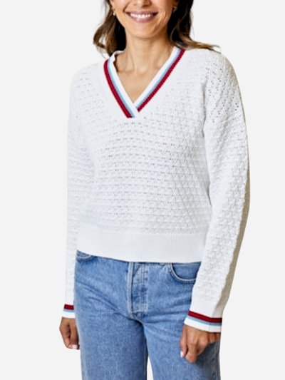 woman in white varsity sweater