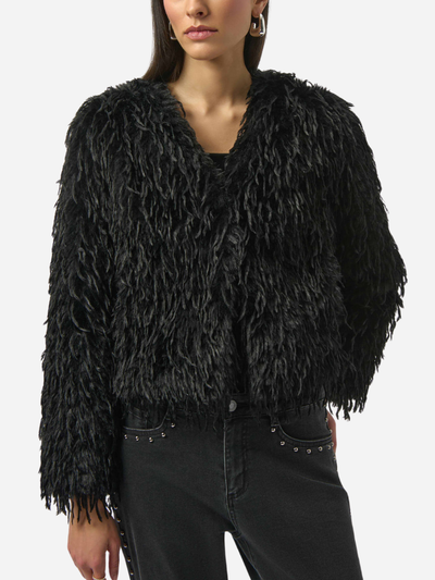 Black shaggy jacket worn by a model on a white background