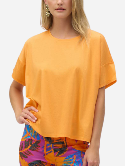 woman in boxy yellow tee