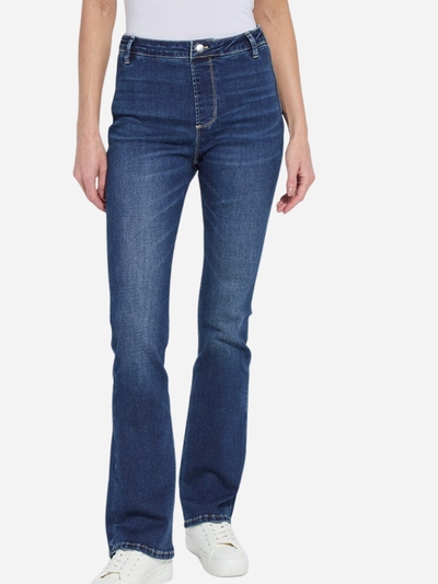 Person wearing flare blue jeans on a white background
