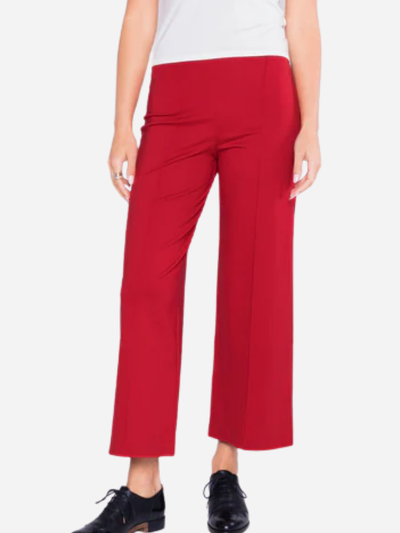 woman in red cropped pants