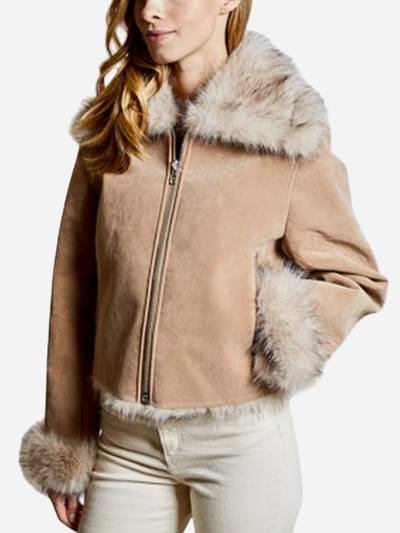 Woman wearing a beige jacket with fur trim on a white background