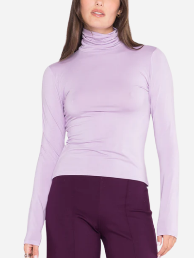 woman in lavender turtleneck