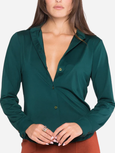 woman in hunter green button down blouse