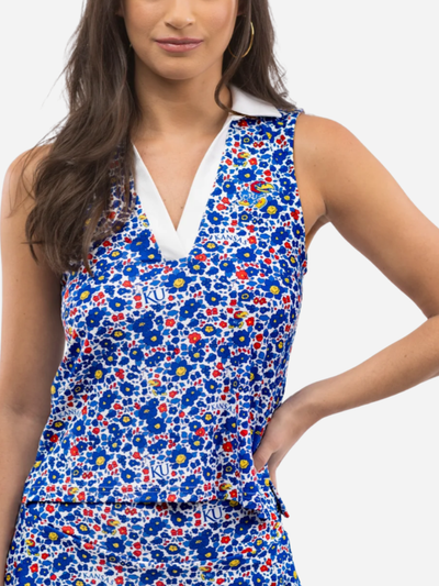 Woman wearing a K.U. Jayhawks floral sleeveless polo top