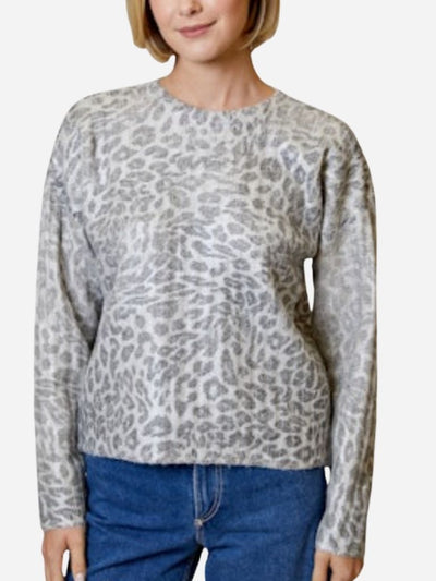 Person wearing a gray leopard print sweater and blue jeans on a white background