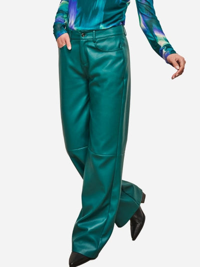 Teal faux leather pants worn by a woman on a white background