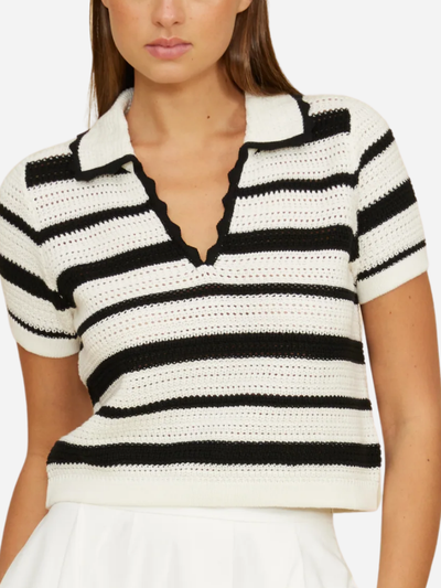 woman in black and white striped polo short sleeve sweater