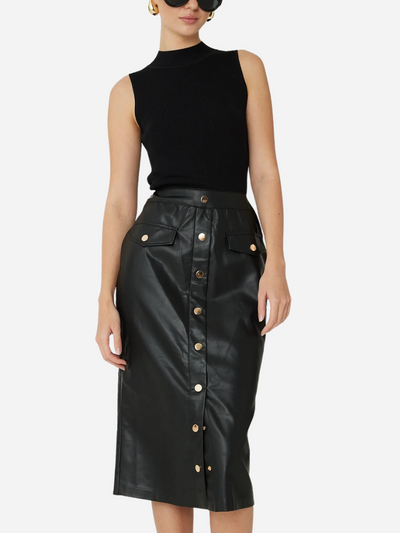 Woman wearing a black sleeveless top and black leather skirt with gold buttons on a white background