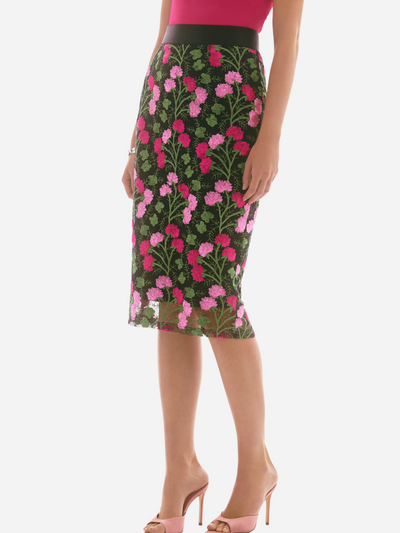 Woman in a black and pink floral pencil skirt