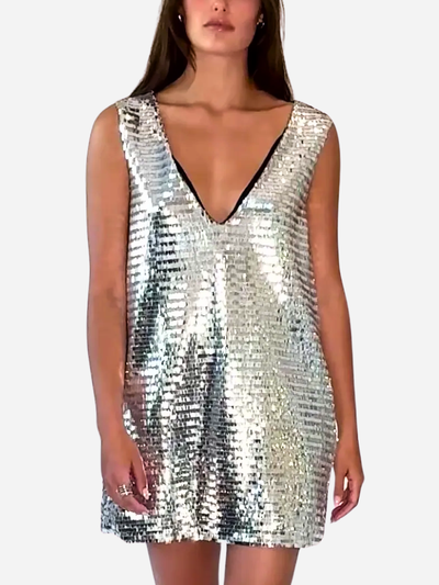 Silver sequin dress worn by a model on a white background