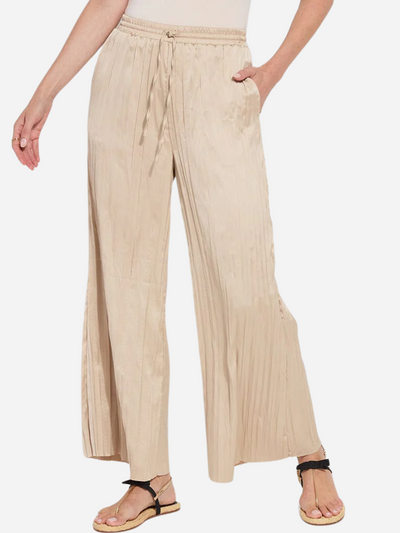 Woman in wide leg packable brown pants