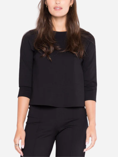 woman in black 3/4 sleeve top