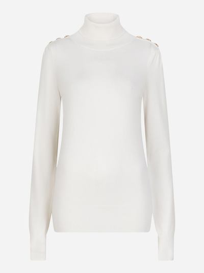 White mock neck sweater with gold buttons on a white background