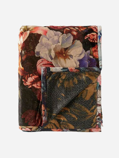 Floral patterned blanket with a reversible dark floral print