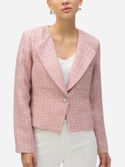 woman in pink blazer