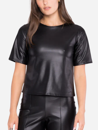 woman in black vegan leather short sleeve tee.
