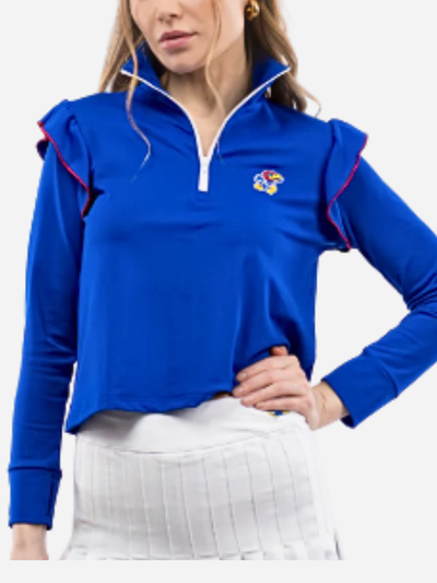 Woman wearing a blue pullover with ruffled shoulders and a K.U. Jayhawk logo on a white background